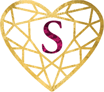 A heart shaped diamond with the letter s in it.