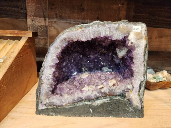 A purple rock with a hole in it