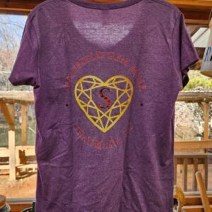 A purple shirt with a heart on it