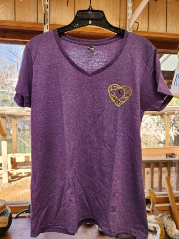 A purple shirt with a heart on it