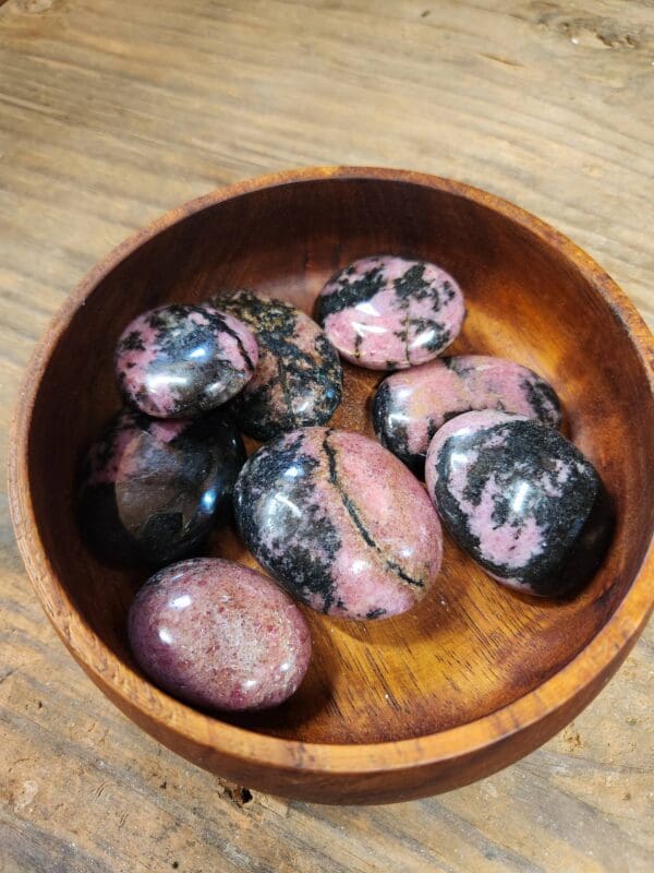 A bowl of rocks sitting on top of a table.