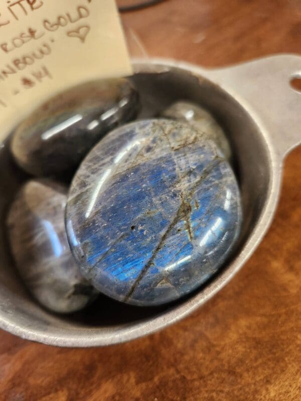 A bowl of rocks sitting on top of a table.