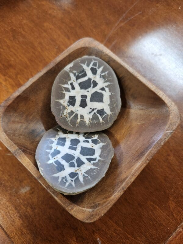 Two pieces of animal print on a wooden bowl.