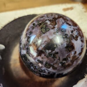 A close up of a brown and black ball