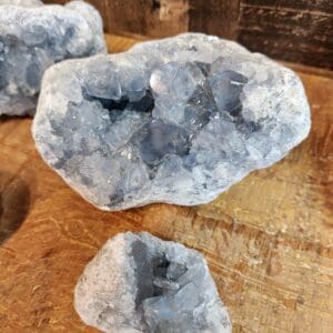 A close up of three pieces of rock on top of a table.