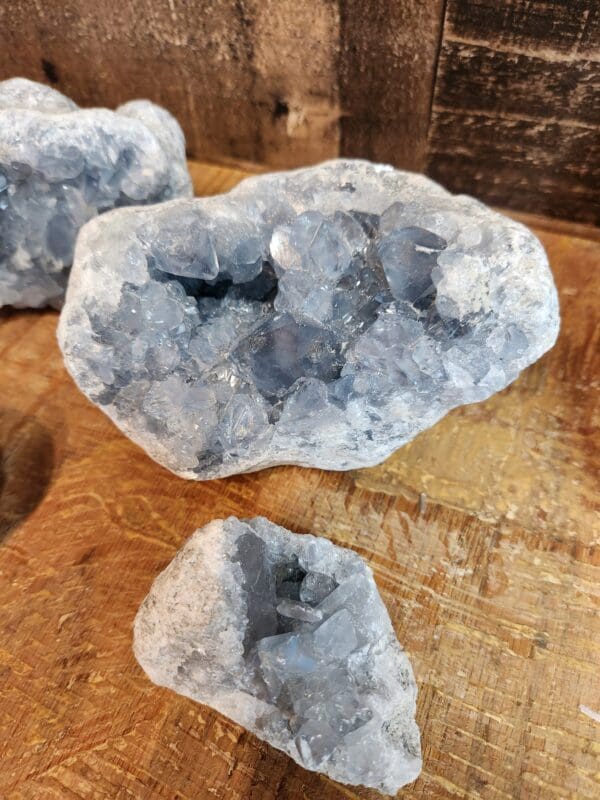 A close up of three pieces of rock on top of a table.